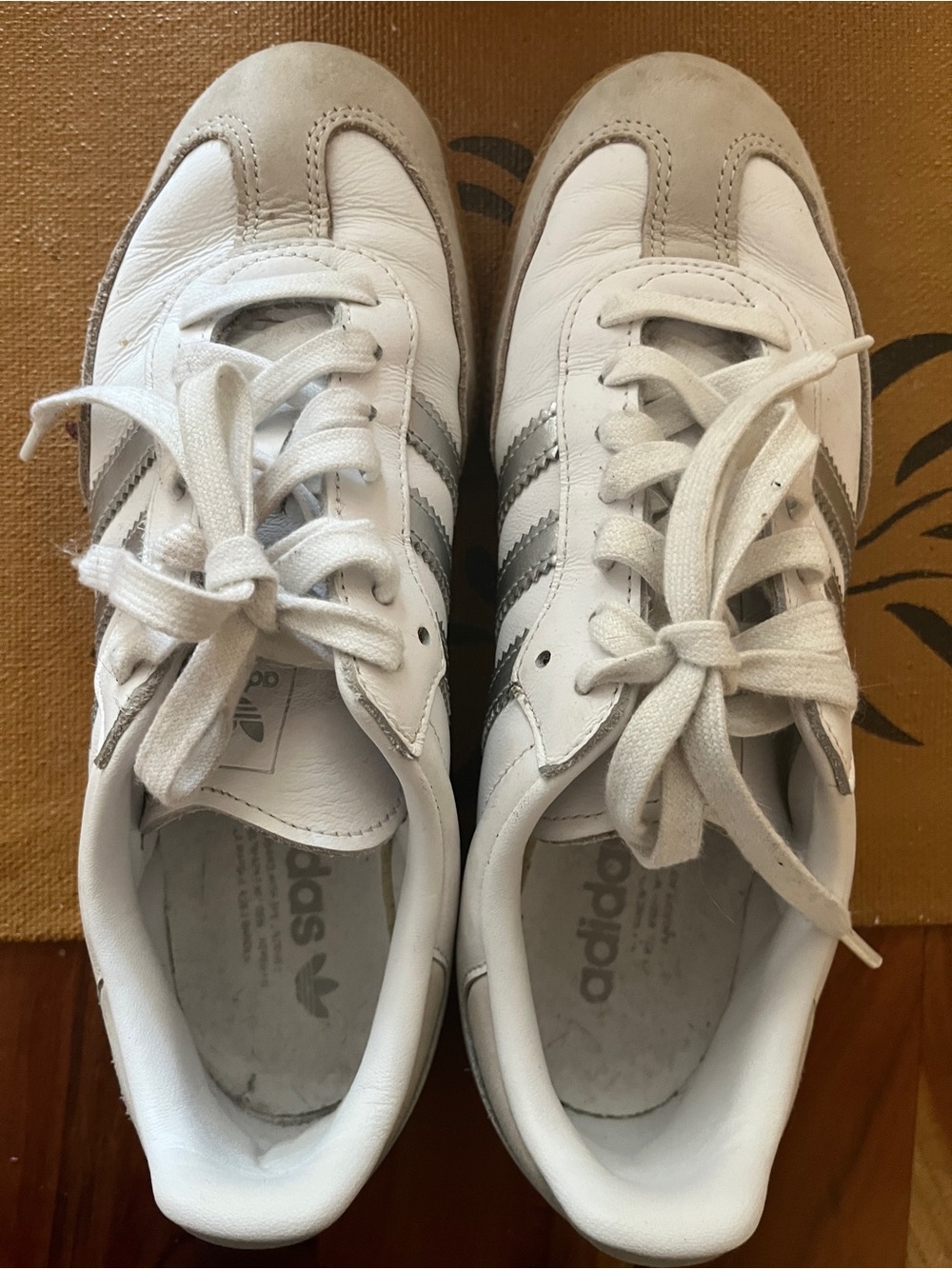 White leather Adidas Samba with silver stripes
